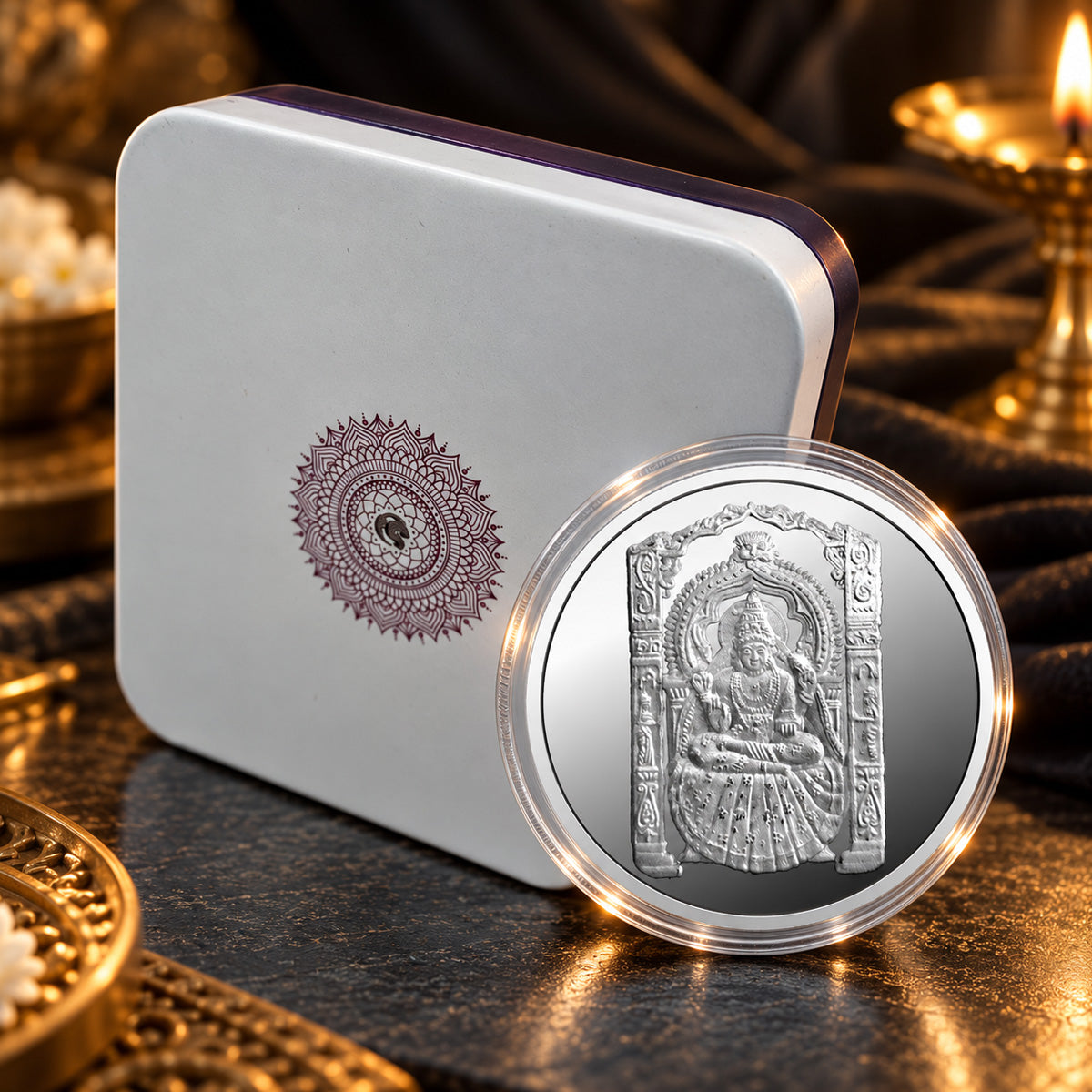 Shringeri Mata silver coin displayed beside a presentation box