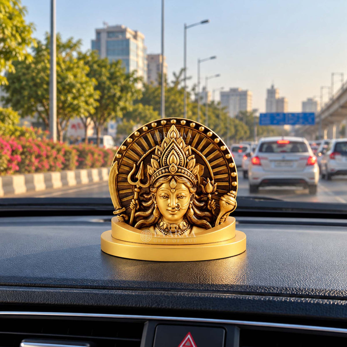 Durga Maa Idol placed on car dashboard for spiritual decoration