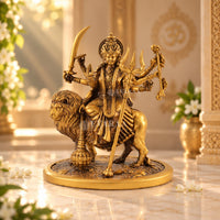 Goddess Durga statue riding a lion with multiple arms and traditional ornaments