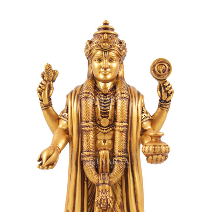 Golden Lord Dhanvantari statue with detailed traditional design