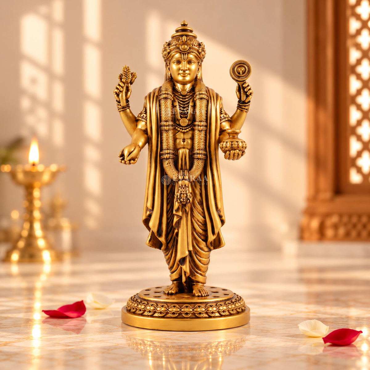 Lord Dhanvantari idol with golden finish displayed in a devotional setting