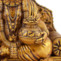 Intricate detailing on Lord Kuber Ji idol