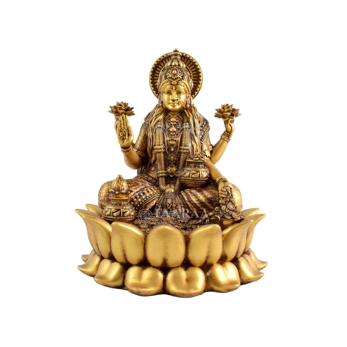 Goddess Lakshmi idol sitting on lotus flower with detailed golden artwork