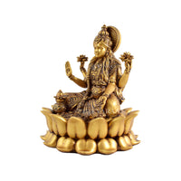 Lotus Laxmi Idol displayed in a decorated spiritual home temple setup