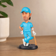 MS Dhoni Cap Bobblehead displayed for cricket fans