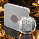 Shringeri Mata silver coin displayed beside a presentation box