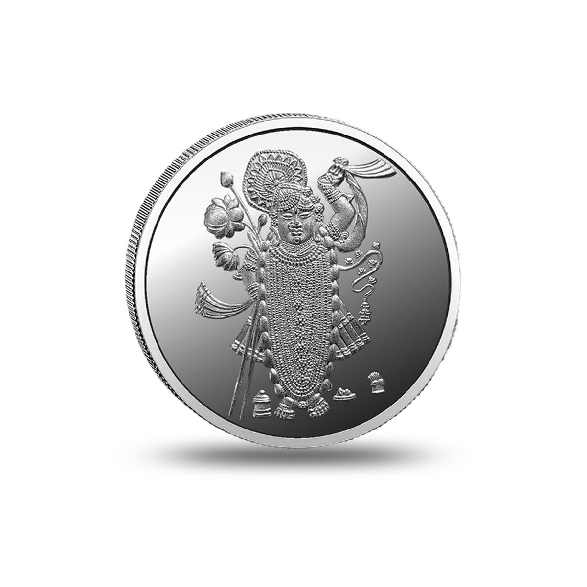 Close-up of the Shrinath Ji devotional design engraved on a silver coin