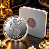 Shrinath Ji silver coin displayed beside its presentation box