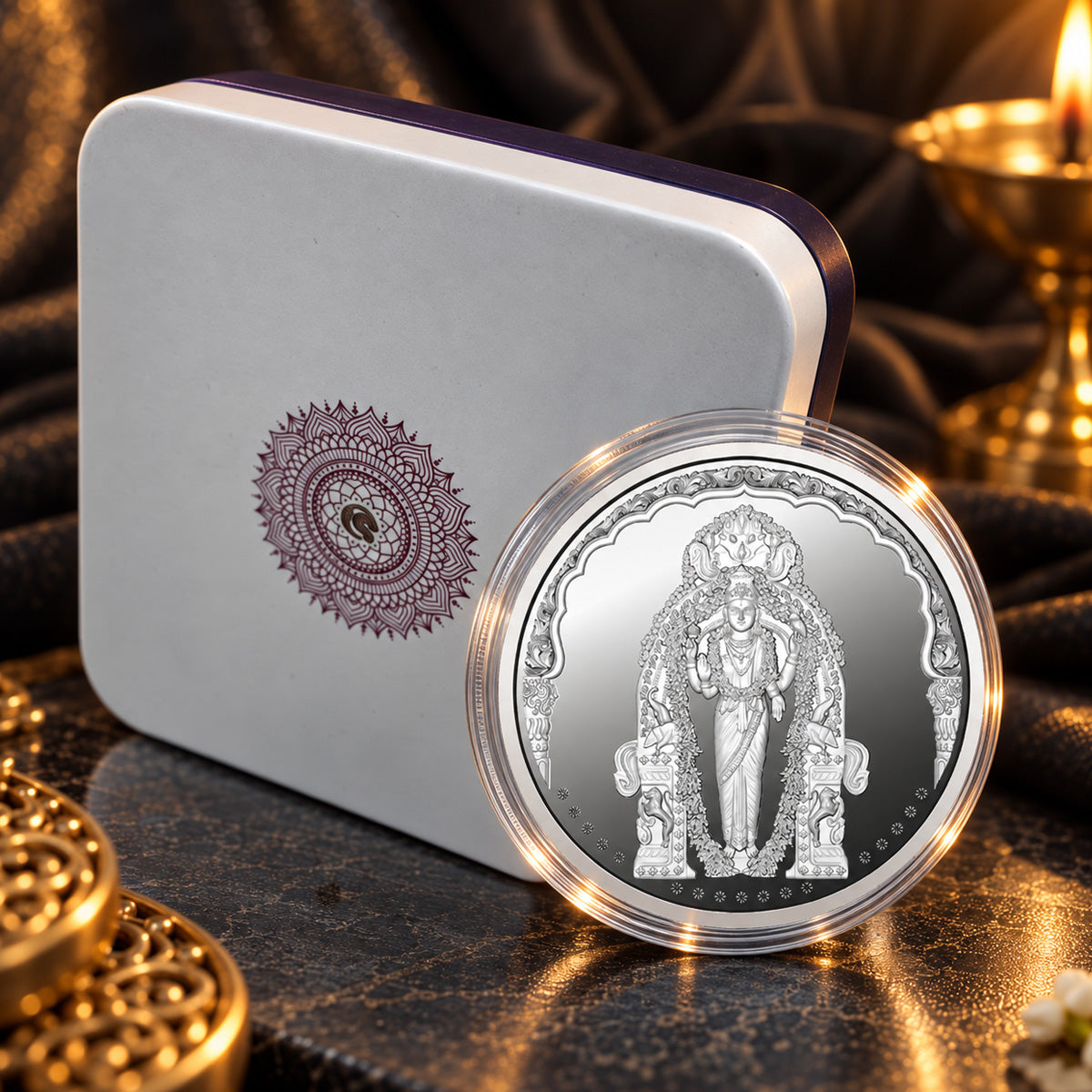 Vasavi Mata silver coin displayed alongside its presentation box