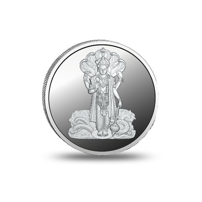 Close-up of the Lord Vishnu design engraved on a silver coin